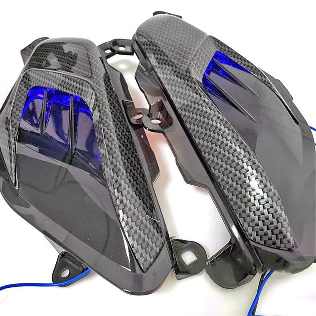 Pair of blue or red LED side lamps for Yamaha NMAX125 and NMAX155 scooters on a white background.