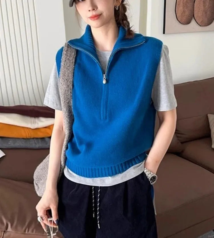 Women's sleeveless half-zip knit vest in mesh fabric, shown in a solid colour with a 3D pattern.