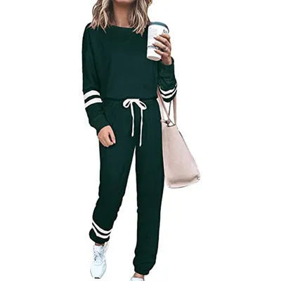 Women's loose-fitting casual suit set in a solid colour, comprising a long-sleeve top and matching trousers.