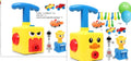 Balloon launch tower toy car with inflated balloon on a white surface