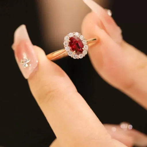Gold pigeon and floral design sterling silver ring with a red blood gemstone inlay.