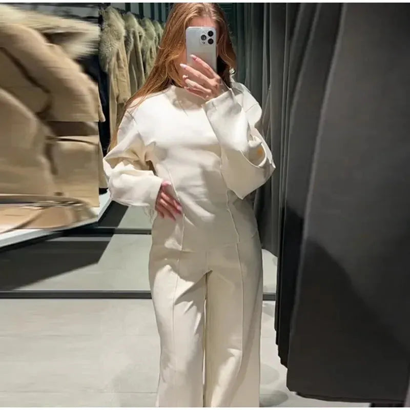 Women's polar fleece two-piece suit set showing long sleeve O-neck top with wide-leg trousers