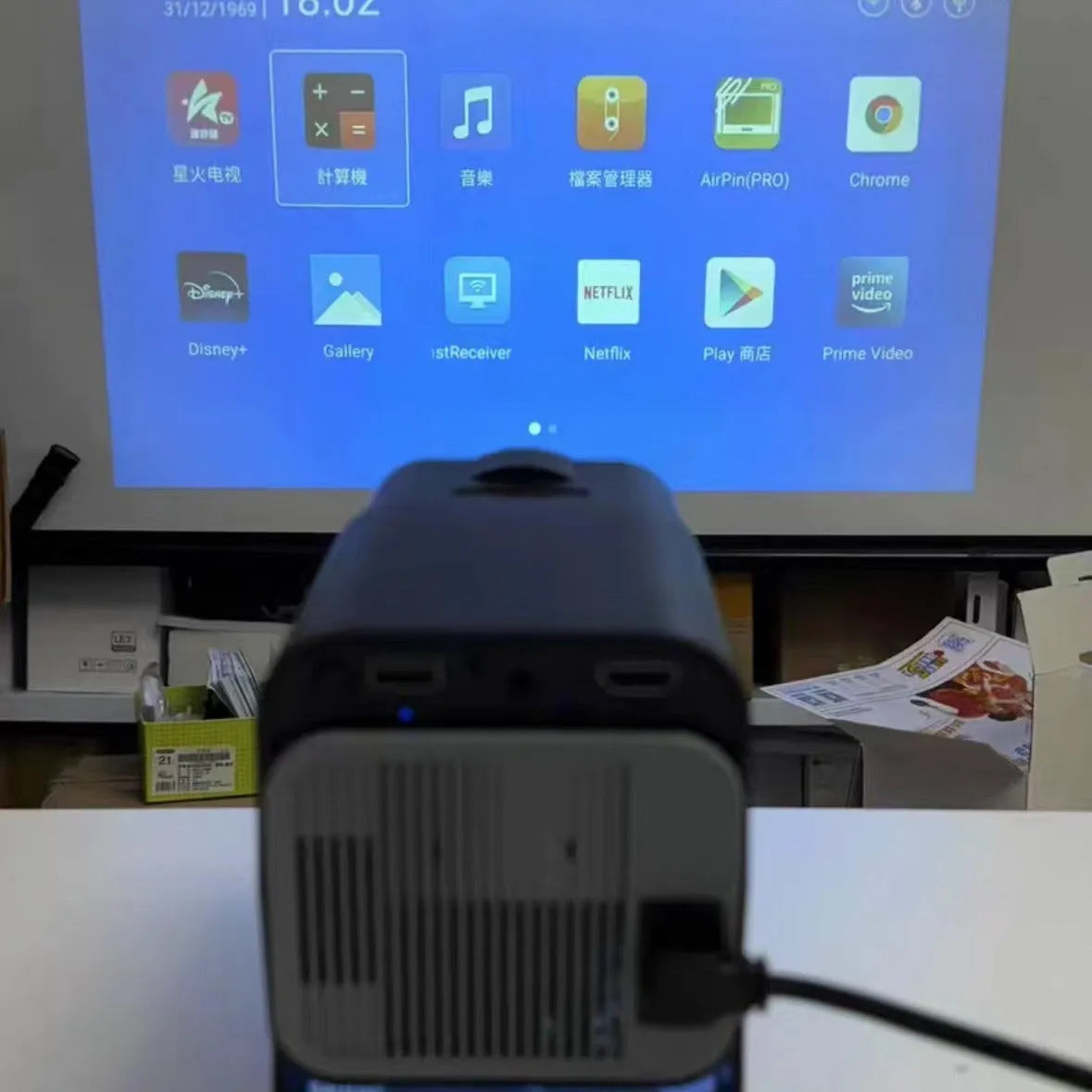 Compact wireless HD game projector with screen handle for home entertainment setup