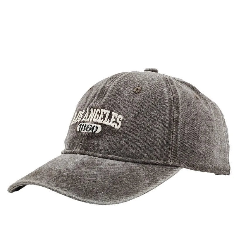 Personalised embroidered retro-style peaked cap in distressed beige with adjustable strap