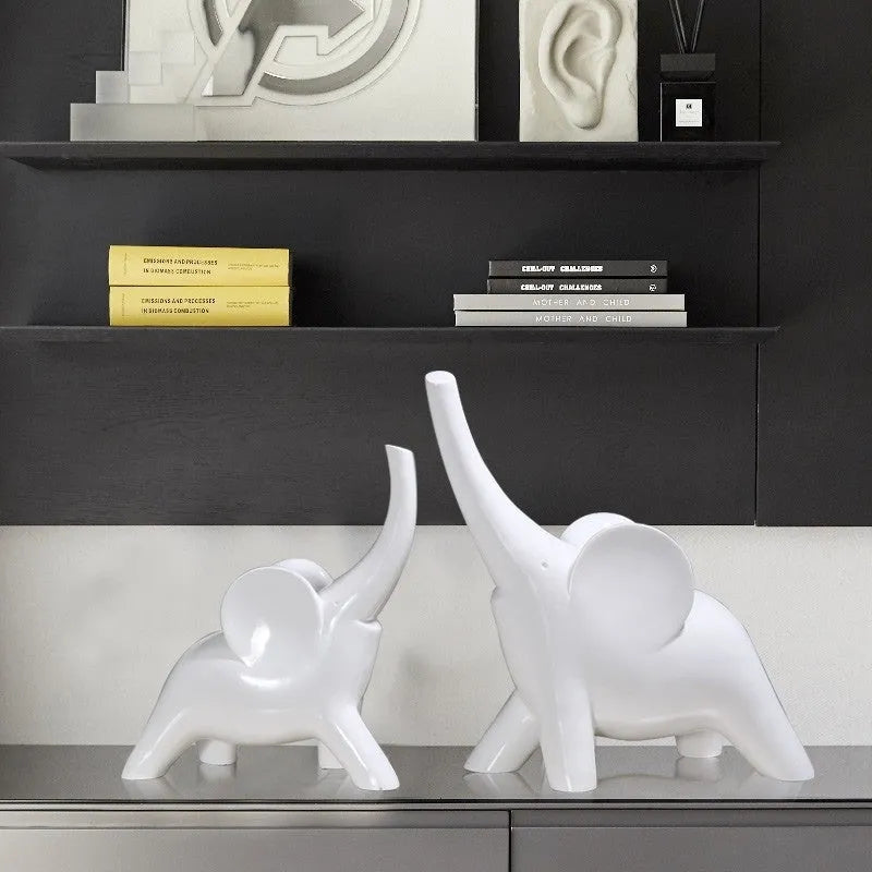 Modern resin elephant ornament in rose gold colour displayed on wooden surface