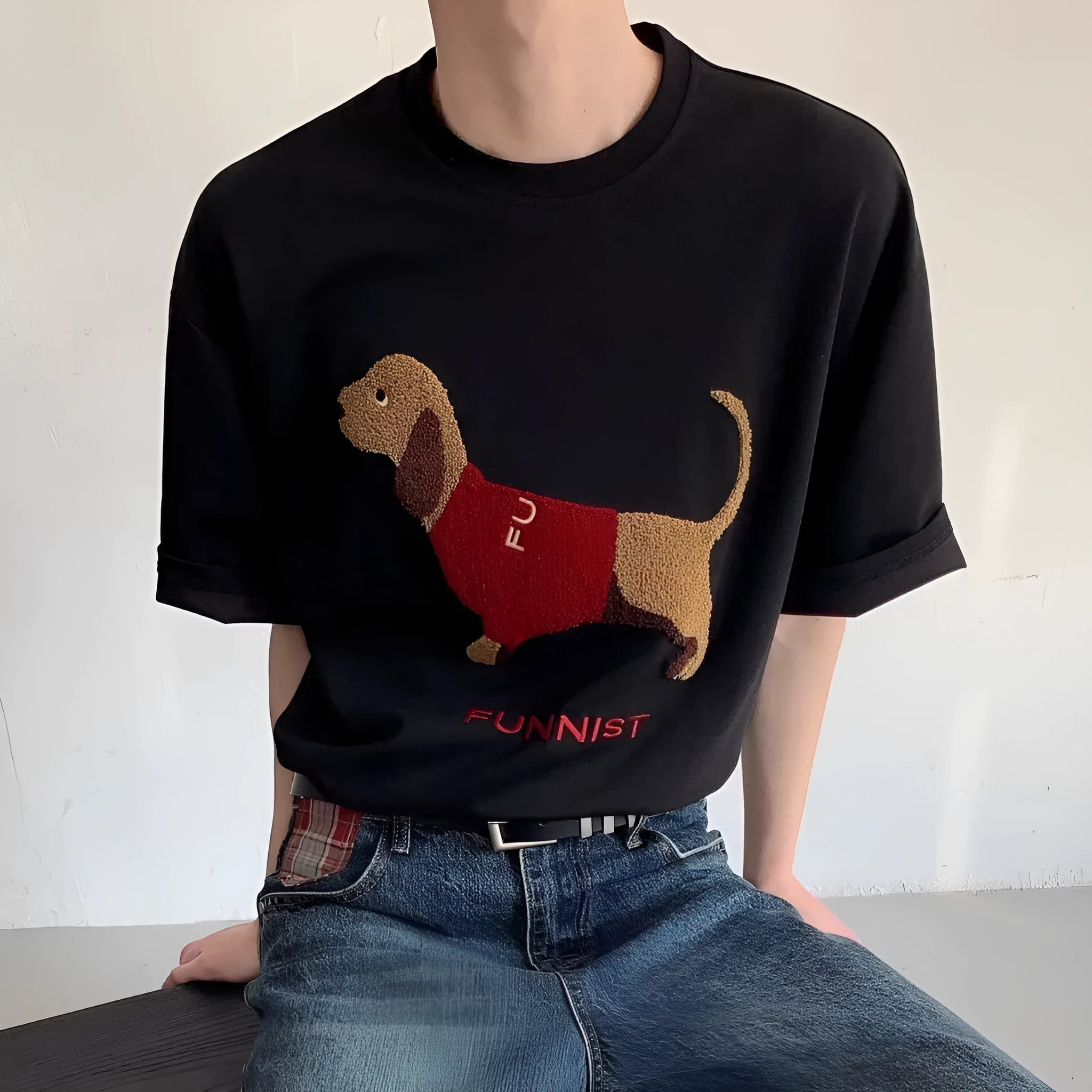 Grey men's T-shirt with a raised towel embroidery sausage dog design on the chest.