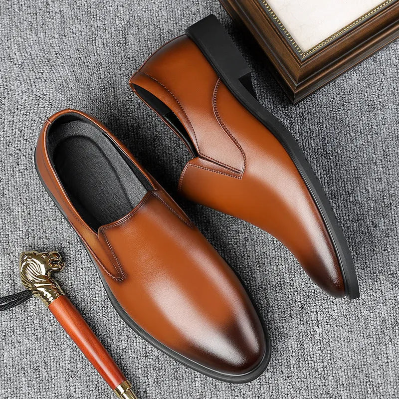 Men's black business casual slip-on leather shoes with a low-top design and rubber sole