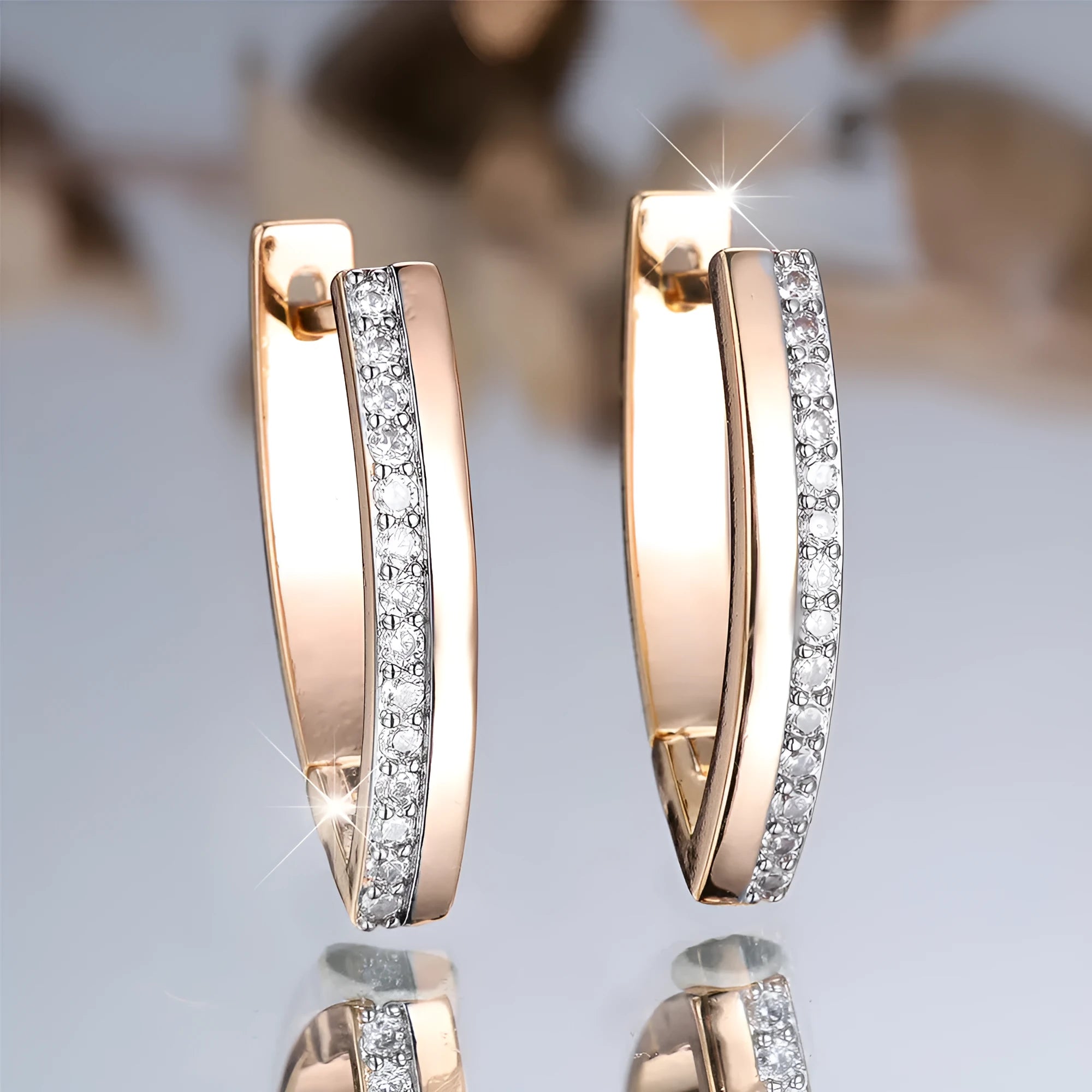 Women's V-shaped geometric ear clips in champagne gold with white diamond colour electroplated finish
