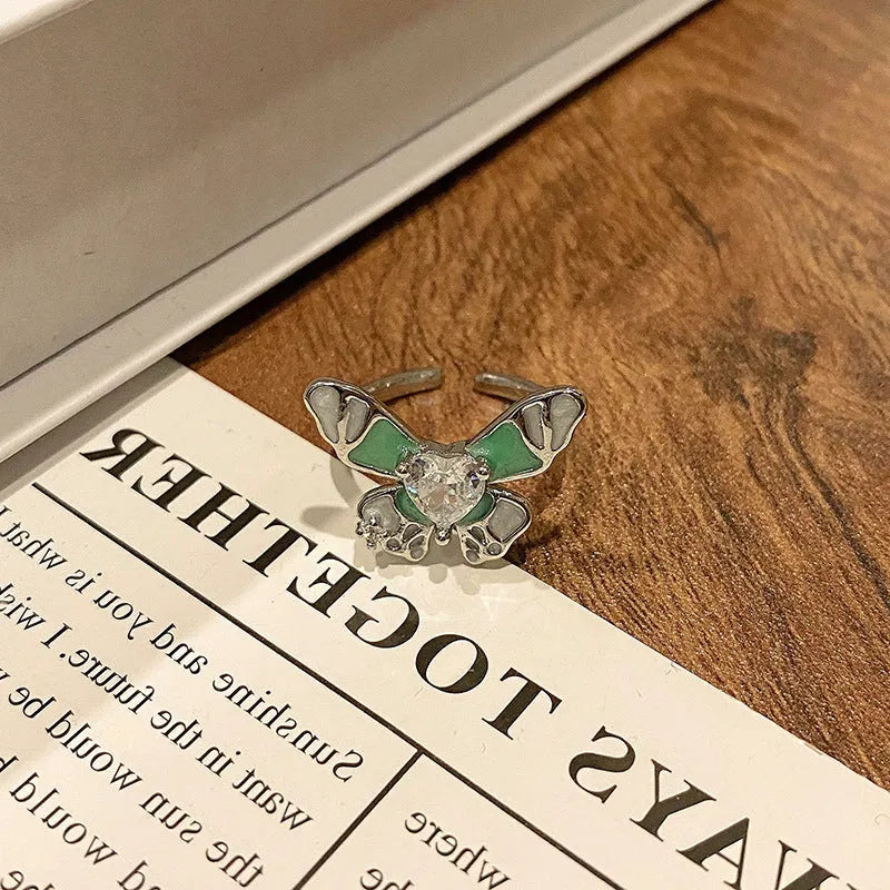 Copper Chinese butterfly women's ring showing creative design with oil dripping treatment finish