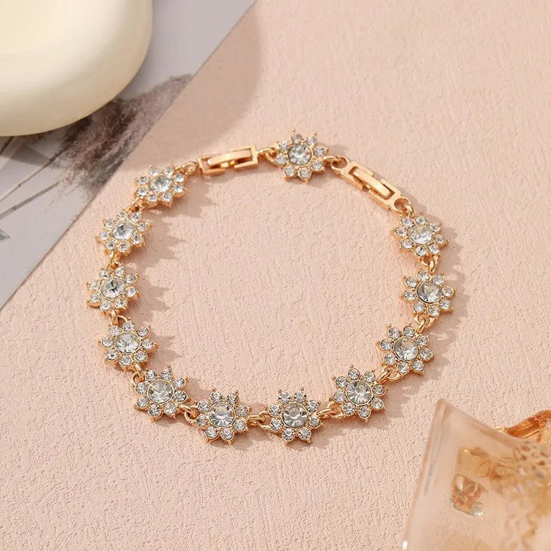 Zinc alloy flower bracelet with electroplated colour finish and colourful crystal decorations in gold and silver variations