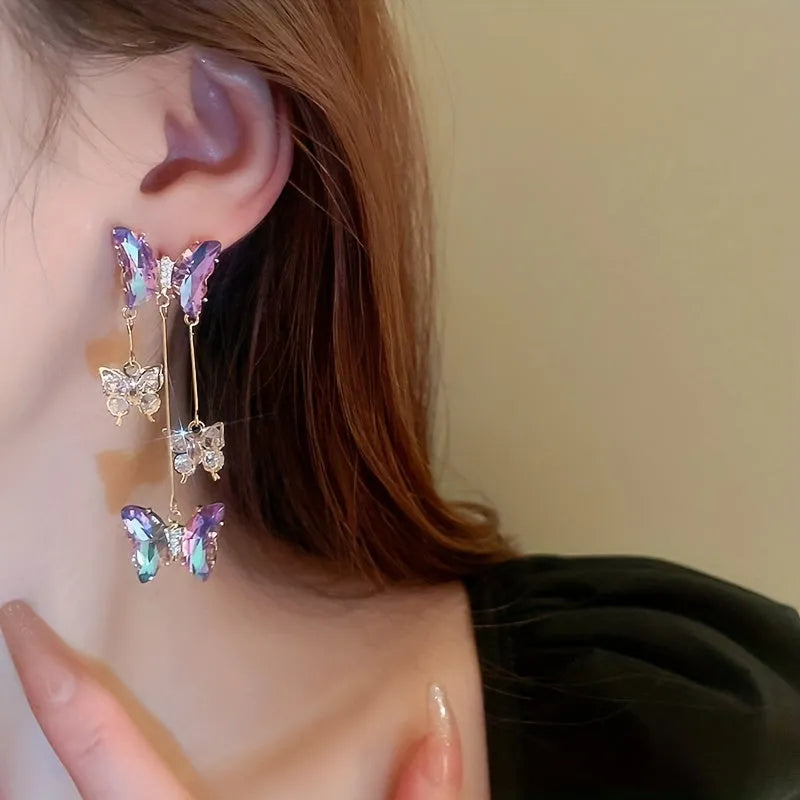 Silver needle colour crystal butterfly earrings with blue-purple electroplated finish and tassel elements