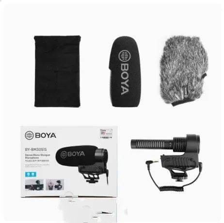 Set top super-heart directional wired microphone with metal grille on desk recording setup