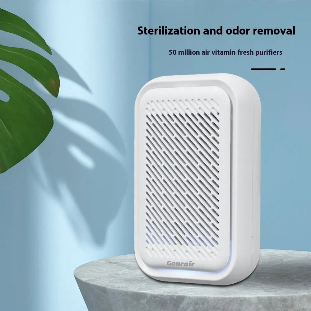 White wall-mounted plug-in air purifier with filter screen for small rooms.