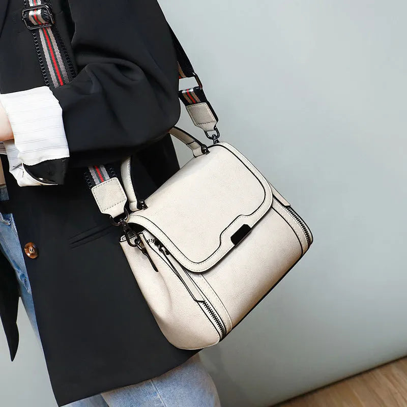 Genuine leather women's messenger bag in horizontal square shape with multiple pockets and double shoulder straps
