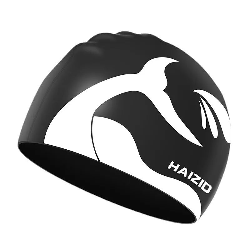 Silicone swimming cap with waterproof ear protectors featuring whale tail pattern design