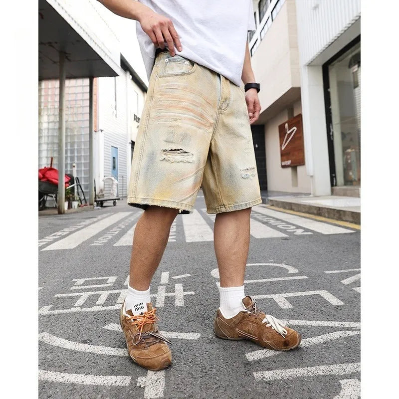 Light blue men's denim shorts with ripped detailing and a straight-leg cut