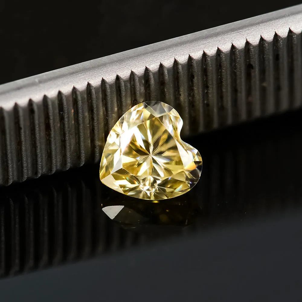 Lemon yellow heart-shaped moissanite stone measuring 5mm by 5mm