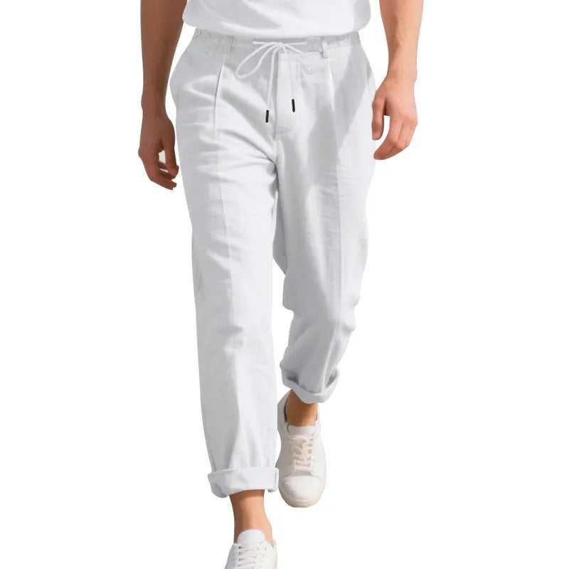 Men's light beige linen casual trousers with drawstring waist and straight-leg fit on a hanger.