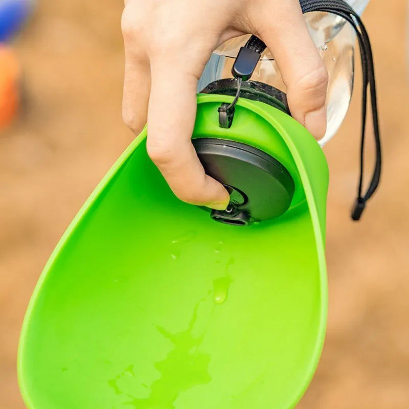 Blue portable dog water bottle with attached wide drinking bowl, showing key lock mechanism