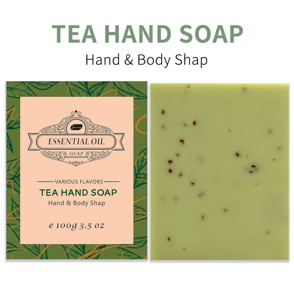 Frosted white handmade essential oil soap bar on a wooden dish with leaves, shown with Coconut, Green Tea, Lavender, and Rose variant labels.