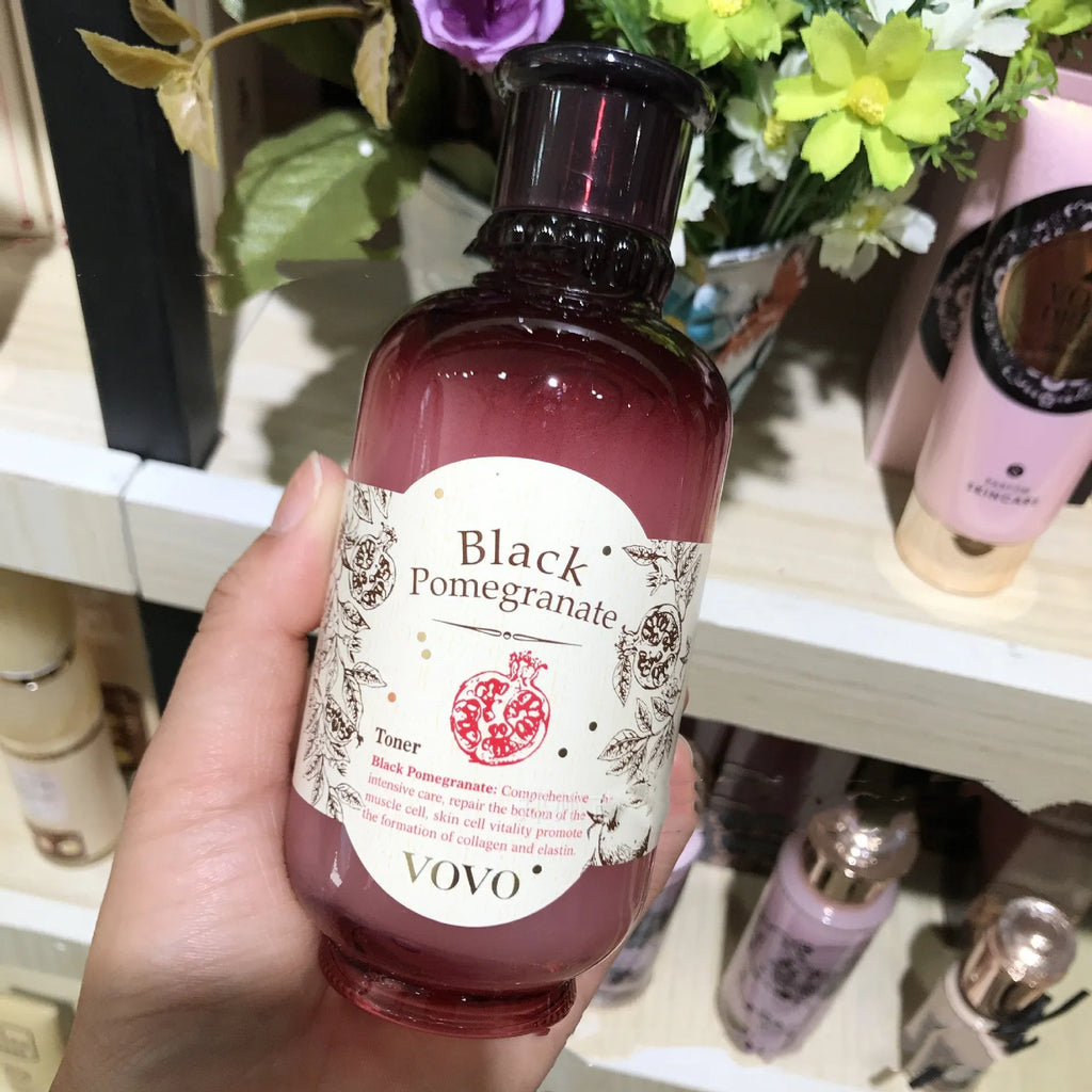 Six products from the pomegranate skin care set: cleanser, toner, essence, milk, cream, and eye cream.