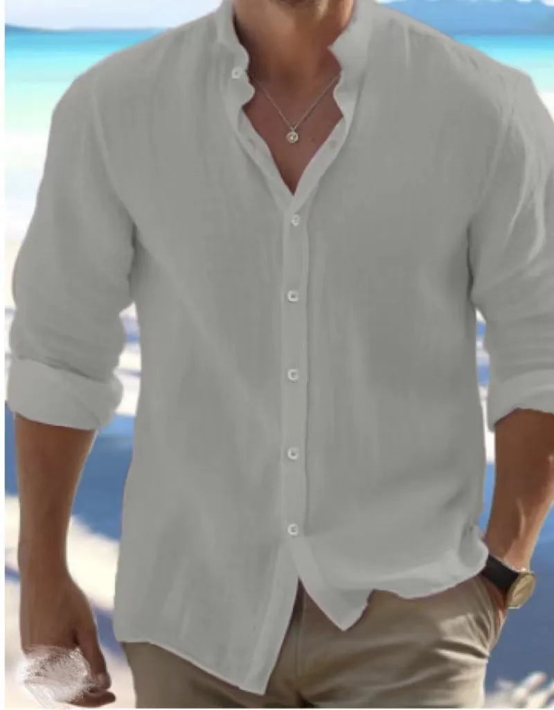 A man's light grey casual pullover shirt made from long-staple cotton fabric, shown on a hanger.