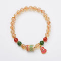 Hand-woven citrine five sutra bracelet with 6mm crystal beads on wrist