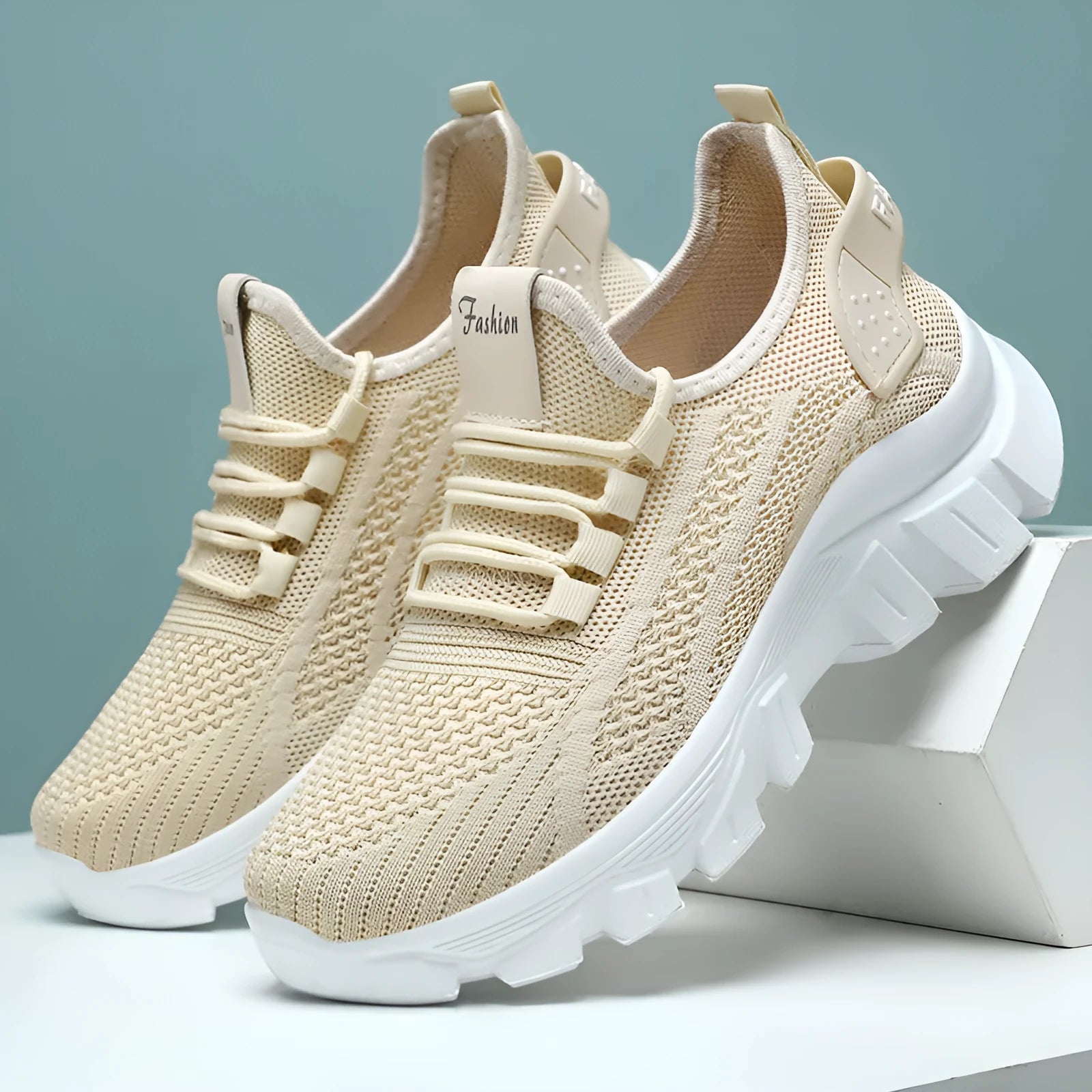 Women's white Flyknit sneakers with a thick PVC sole and front lace-up on a plain background.