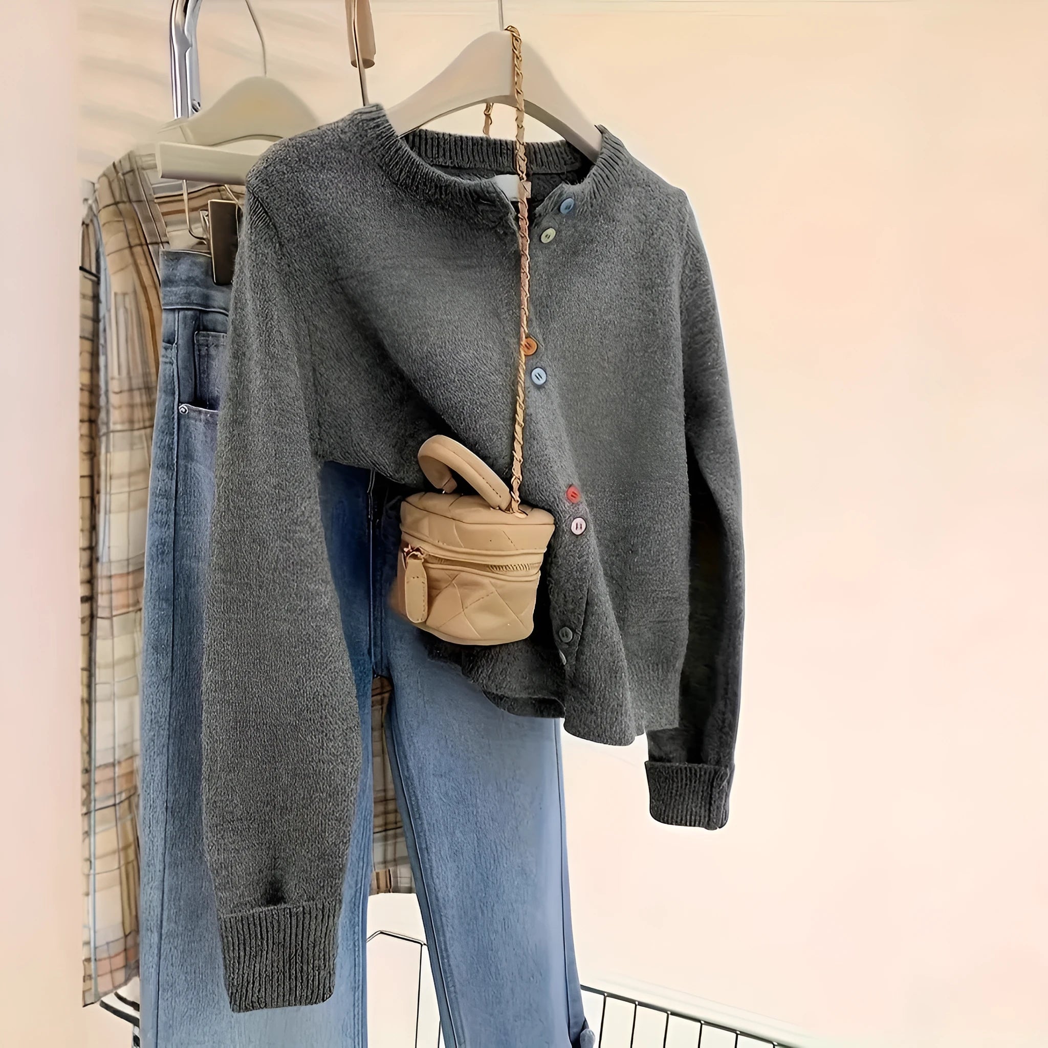 Dark grey women's cardigan sweater with button front and regular sleeves for office commuting