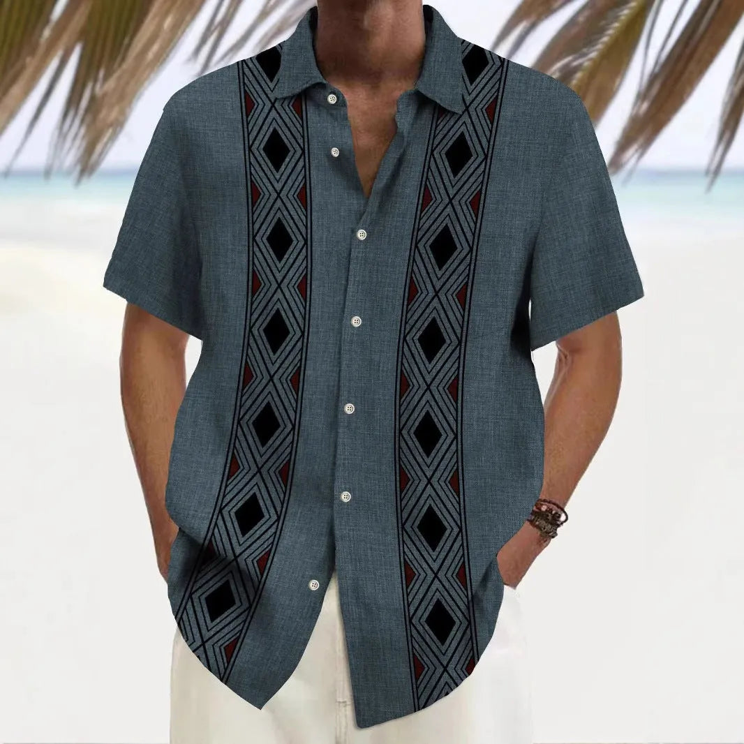Man wearing a loose-fitting, multicolour printed cardigan-style polyester shirt.