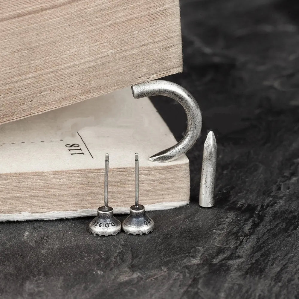 Sterling silver punk nail earrings with ear hook design showing straight and curved options