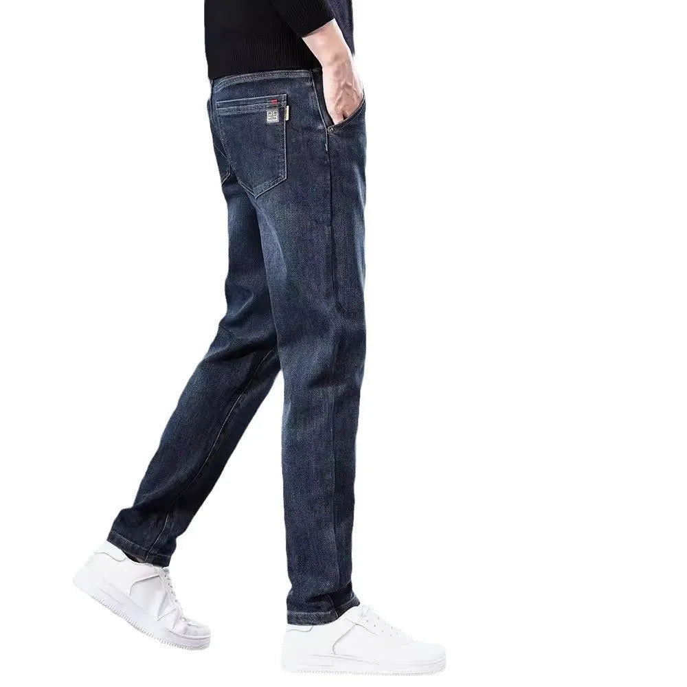 Blue grey slim straight casual trousers with a mid-waist and elastic comfort on a neutral background.