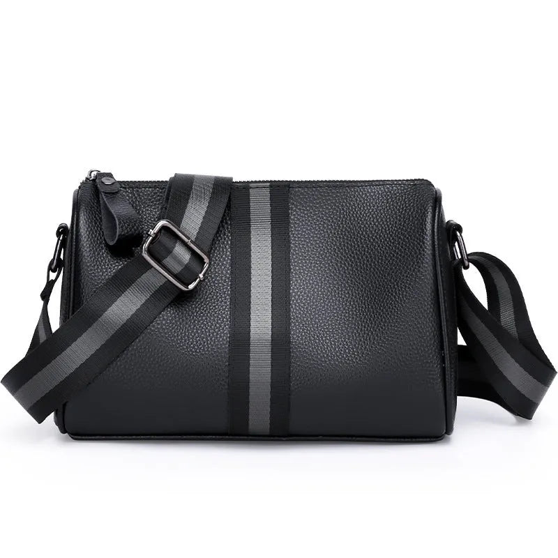 Black genuine leather one-shoulder crossbody bag showing its large capacity and crossbody strap.