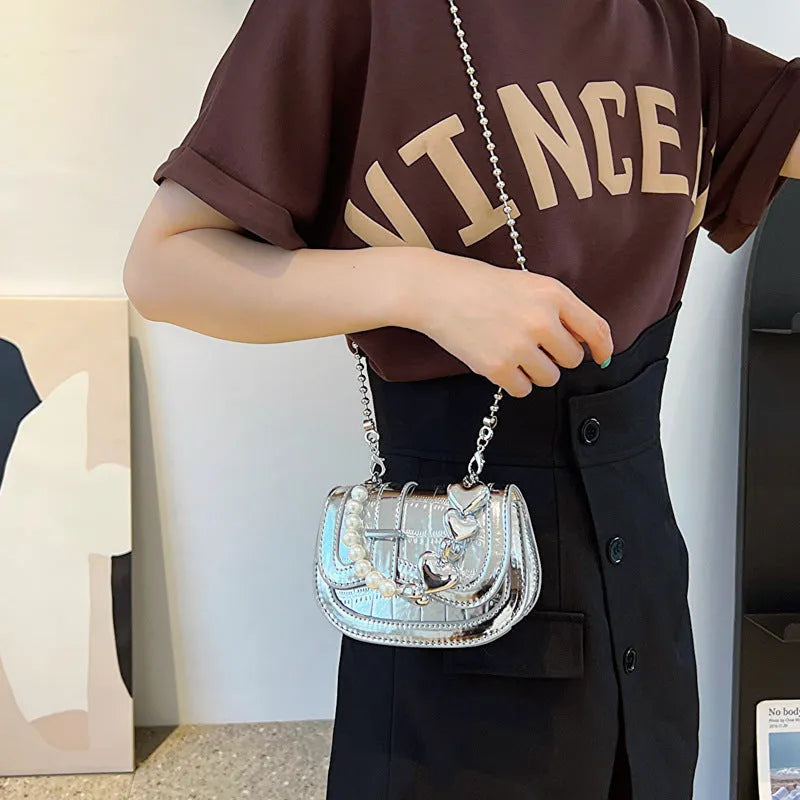 Silver PU leather mini tote saddle crossbody bag for women with a single strap.