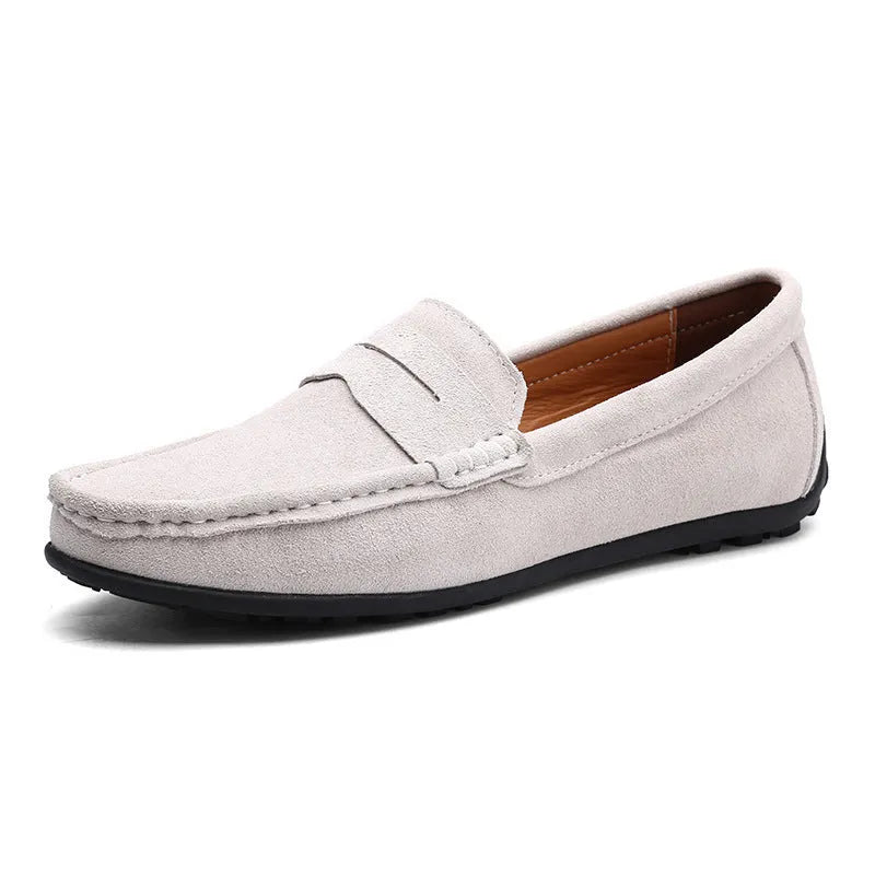 Men's suede Gommino-style loafers in a range of colours on a flat rubber sole.