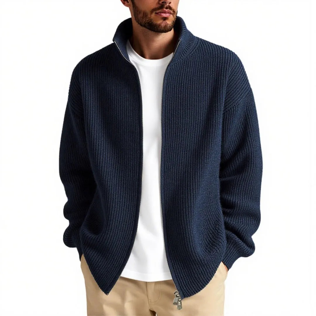 Man wearing a loose grey men's cardigan sweater, a casual acrylic knitwear piece for leisure.