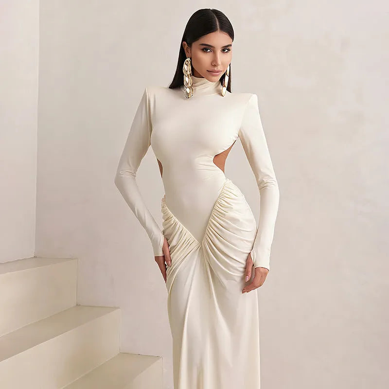 Women's slim fit backless dress with long sleeves, high collar, and pleats in light apricot colour