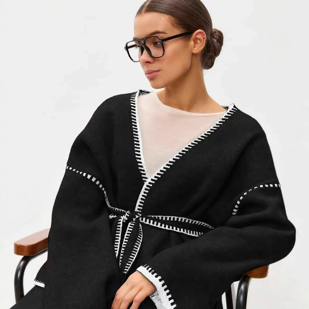 Lace-up front knitted cardigan in imitation cashmere fabric showing loose fitting design and long sleeves