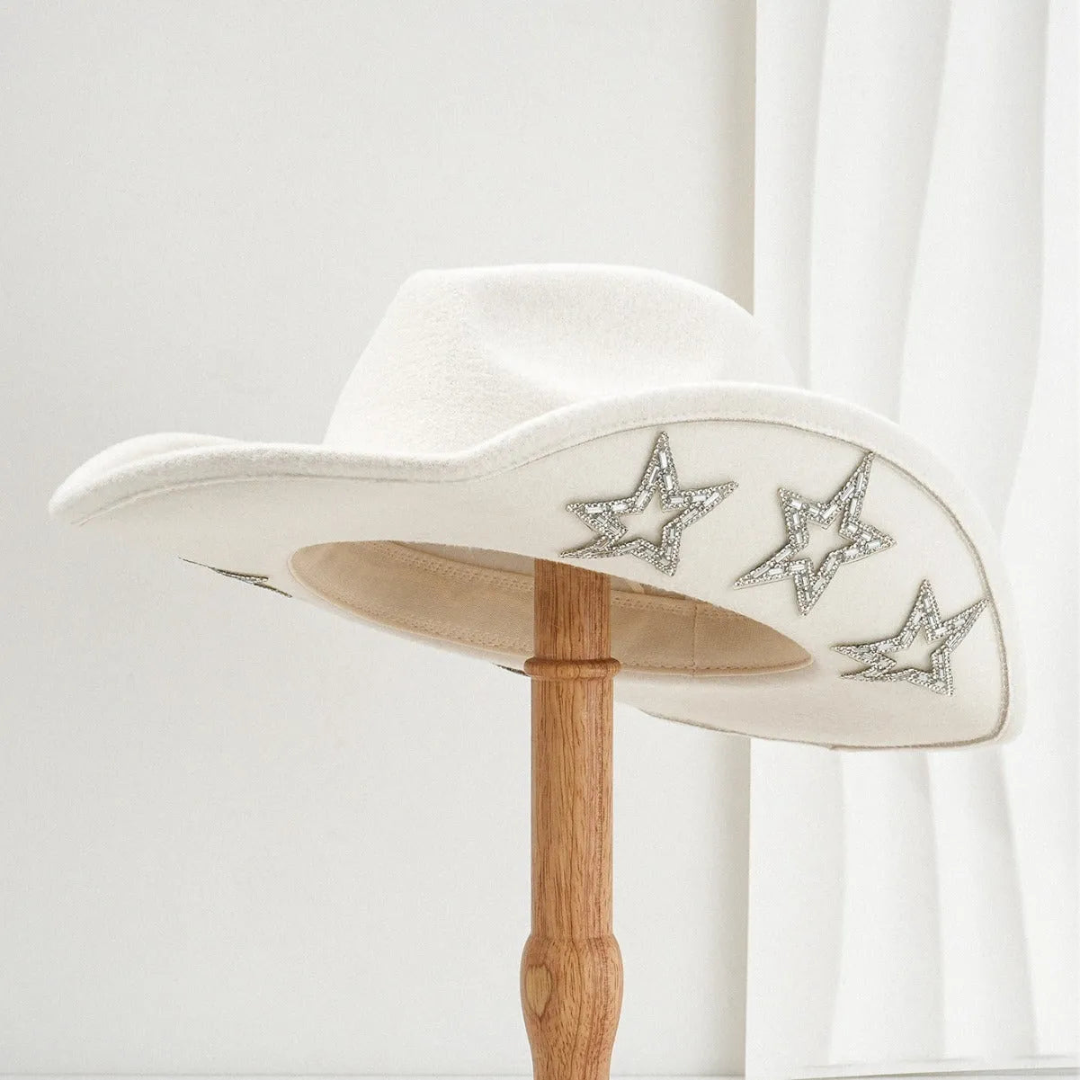 Beige polyester Western denim top hat with a conical crown and a hexagonal star decoration on the front.