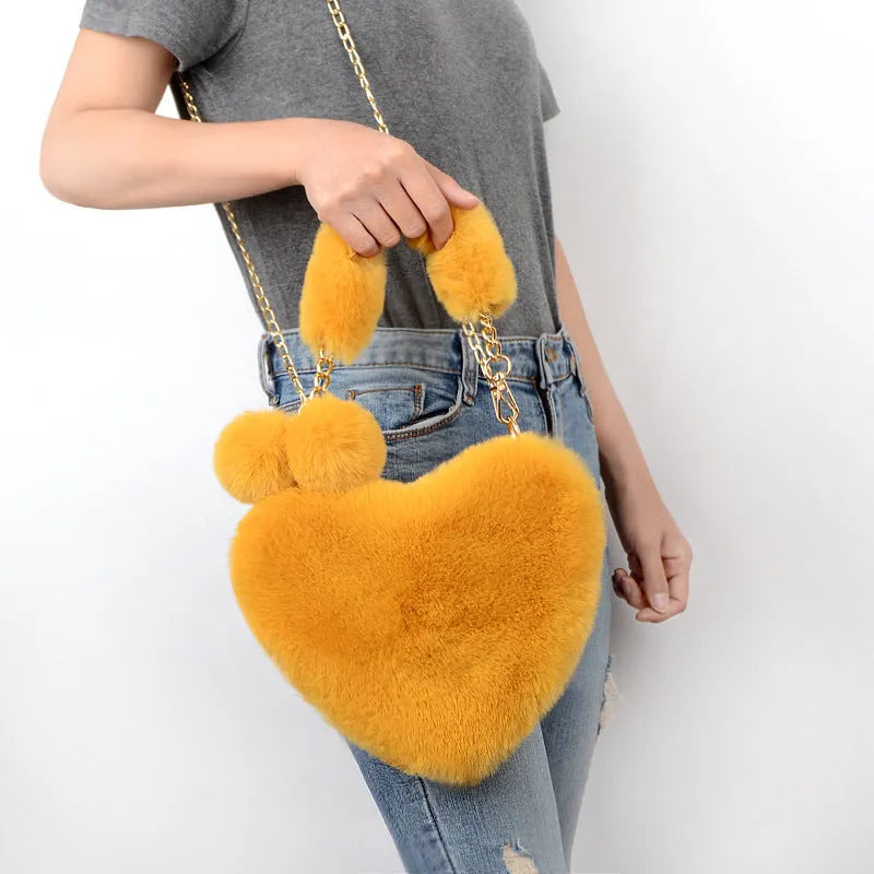 Heart-shaped women's plush handbag with soft texture and detachable shoulder strap in medium size