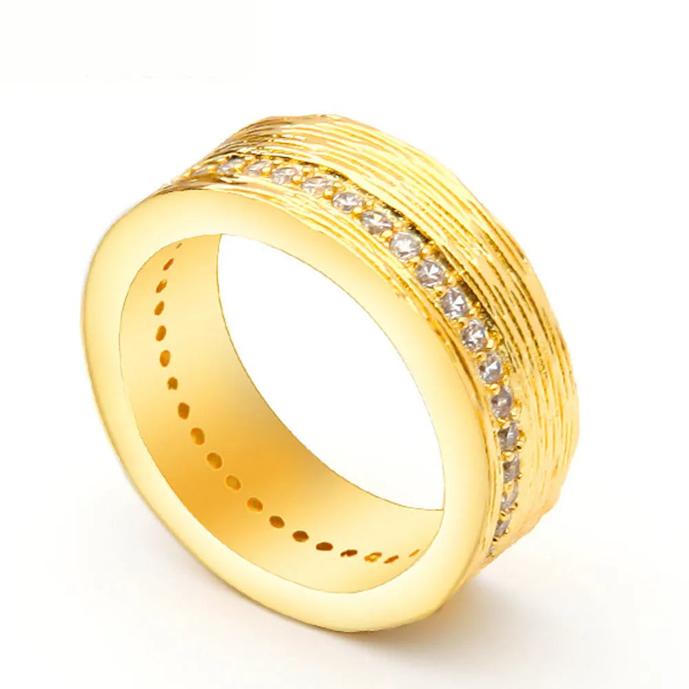 Gold geometric zircon ring with angular design on copper construction