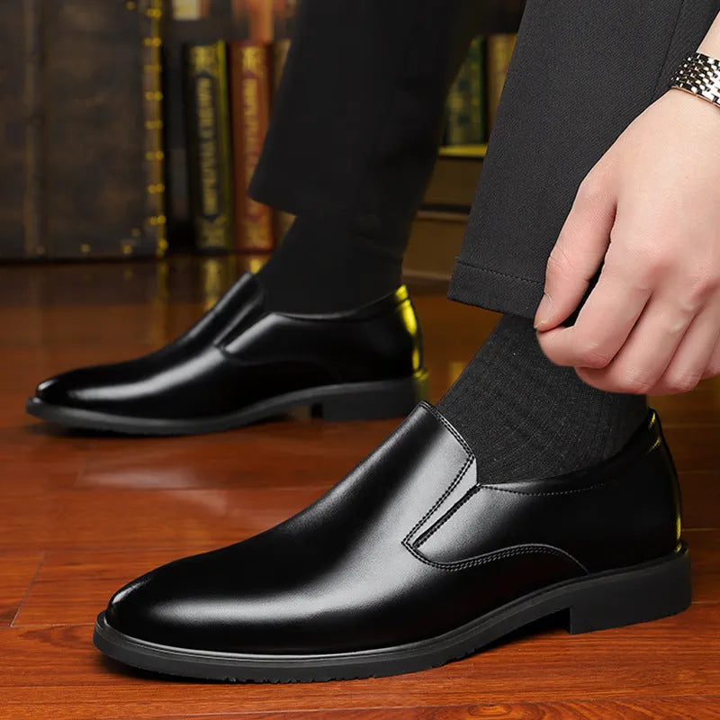 Men's black business casual slip-on leather shoes with a low-top design and rubber sole