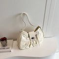 Women's horizontal square PU crossbody bag in black with single strap for shoulder or underarm carry, 30cm length