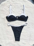Black low-waist women's bikini swimsuit with stitching detail on a mannequin