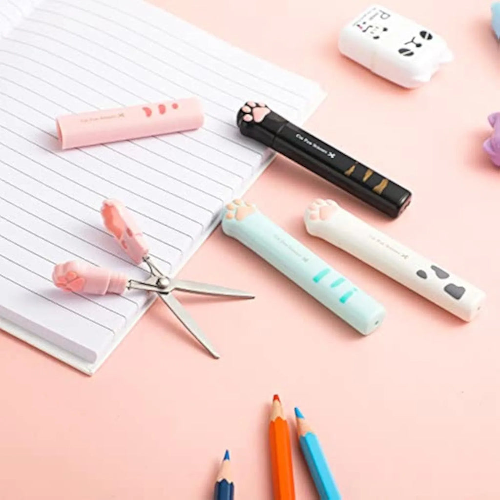 Closed pink cat paw mini folding safety scissors showing the cartoon handle design.