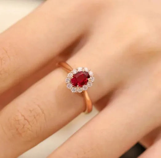 Gold pigeon and floral design sterling silver ring with a red blood gemstone inlay.