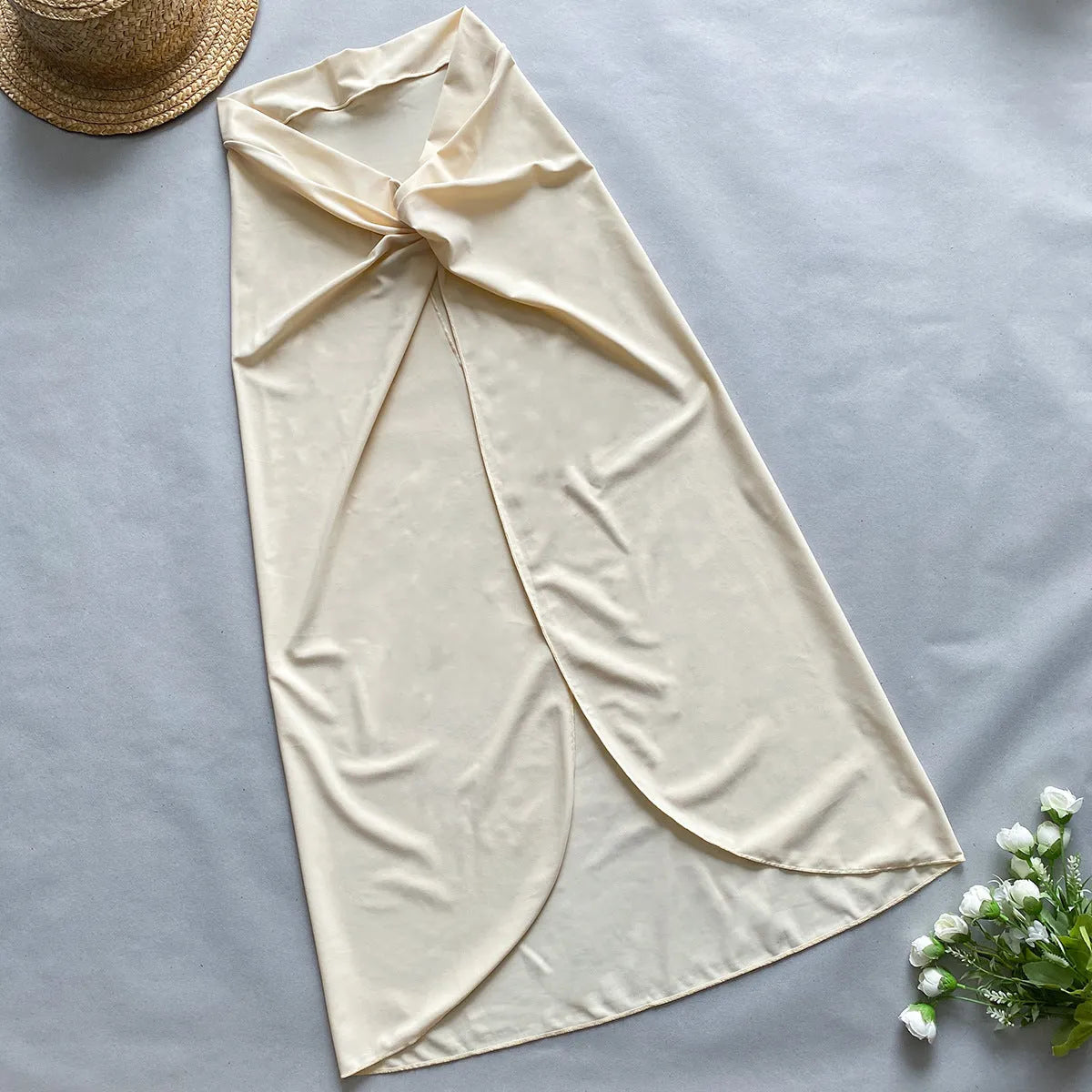 Women's brown one-piece swimsuit with matching beige skirt cover-up on size mannequin