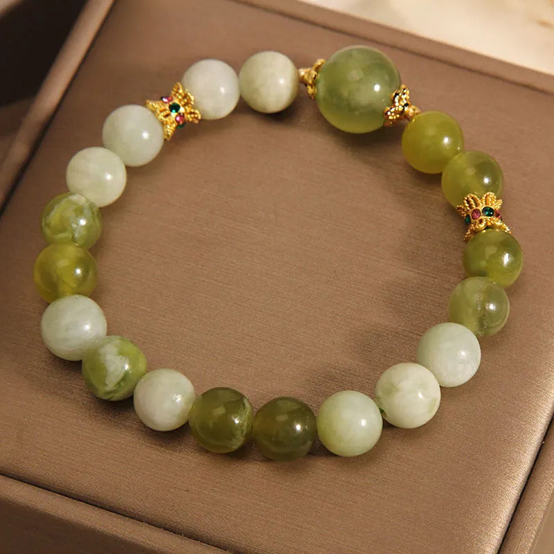 Xiuyan jade green Mori-style women's bracelet on a wrist.