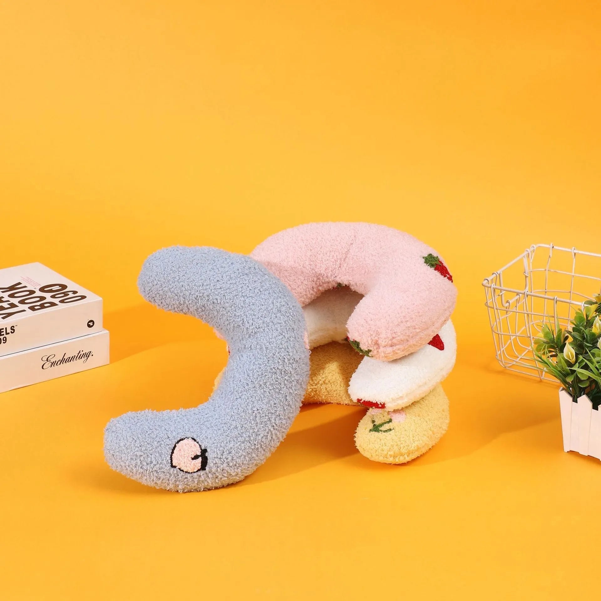 Blue half moon U-shaped cat pillow with cartoon dog and cat design for pet crates.