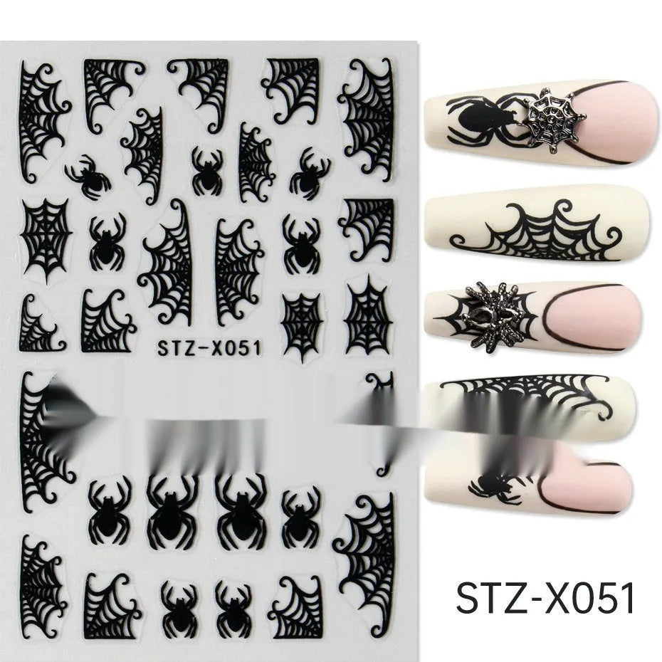 Close-up of a cartoon-style nail sticker with black and silver strips and a love pattern design on a fingernail.